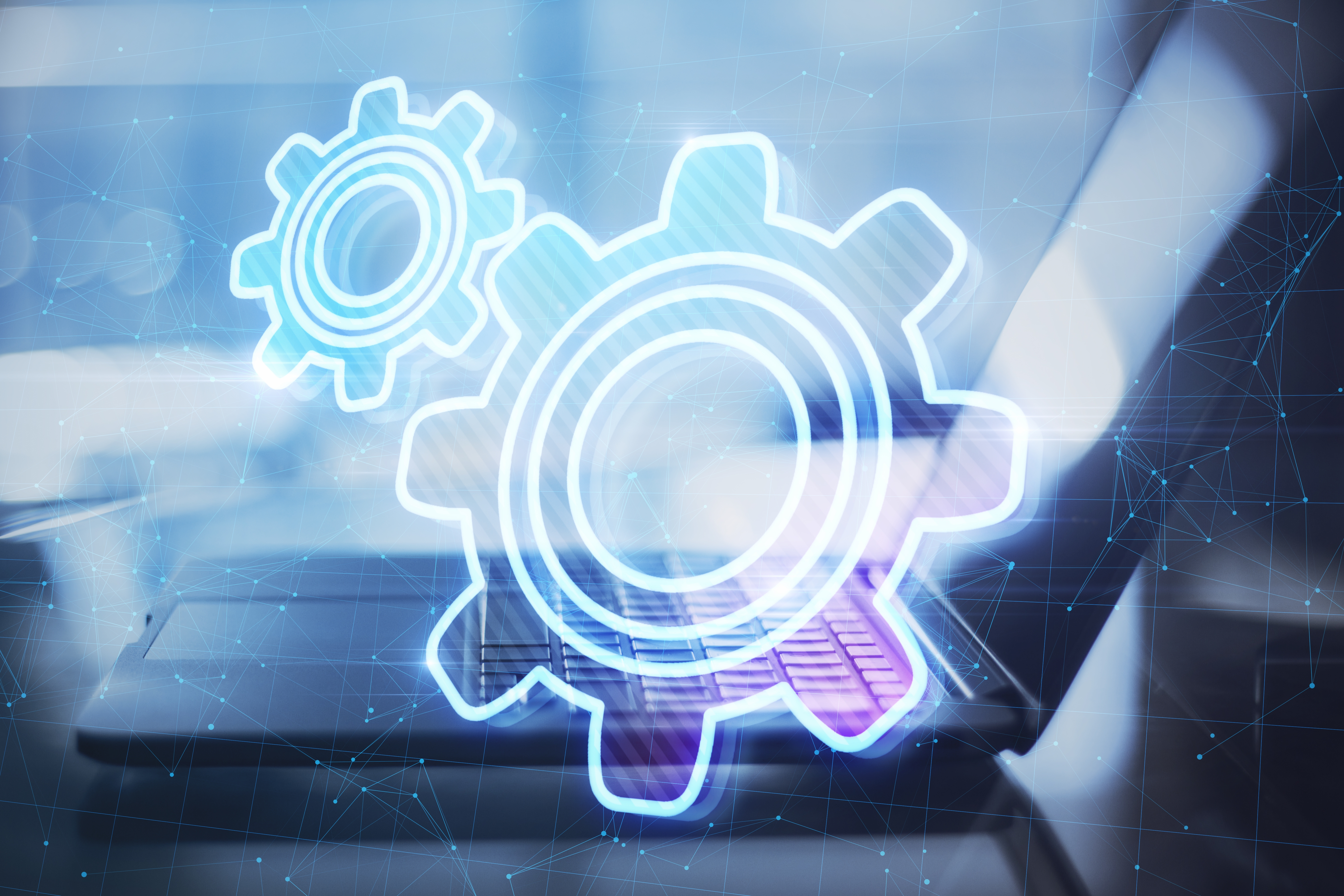 Laptop with glowing automation gears